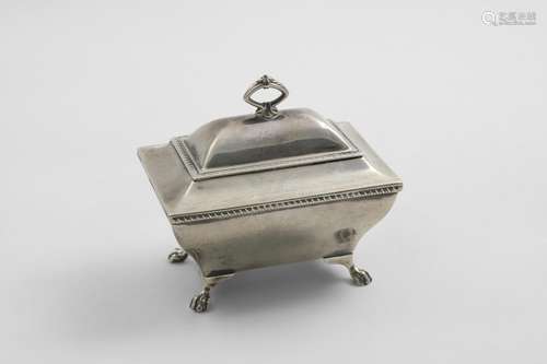 AN EDWARDIAN TEA CADDY on four paw feet with a domed cover, ...