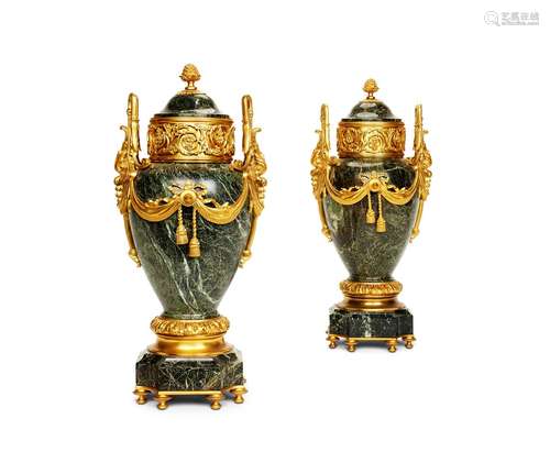 A PAIR OF VERDE ANTICO MARBLE AND GILT METAL MOUNTED URNS