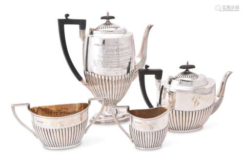AN EDWARDIAN SILVER OVAL HALF REEDED FOUR PIECE TEA AND COFF...