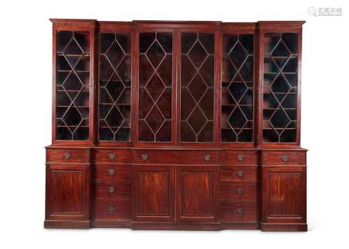 A GEORGE III MAHOGANY TRIPLE BREAKFRONT LIBRARY BOOKCASE