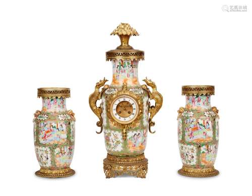 A CHINESE PORCELAIN AND FRENCH GILT METAL MOUNTED CLOCK GARN...