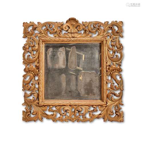 AN ITALIAN CARVED GILTWOOD WALL MIRROR, LATE 19TH CENTURY