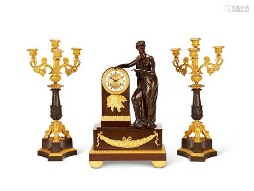 A BRONZE AND GILT BRONZE MANTEL CLOCK