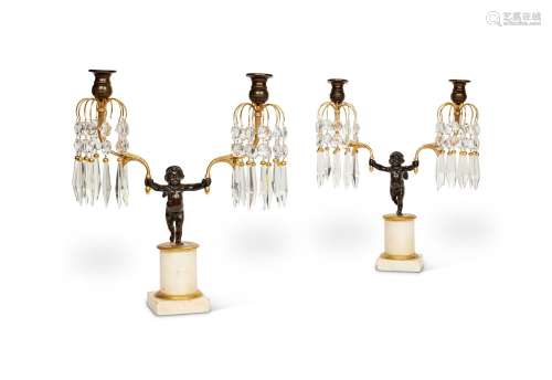 A PAIR OF BRONZE AND ORMOLU TWO BRANCH CANDELABRA