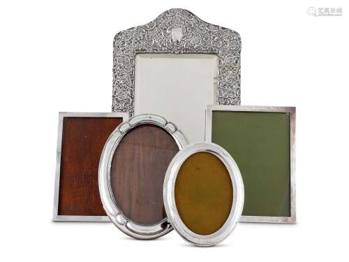 FIVE VARIOUS SILVER FRAMES THE FIRST WITH A BEVELLED MIRROR ...