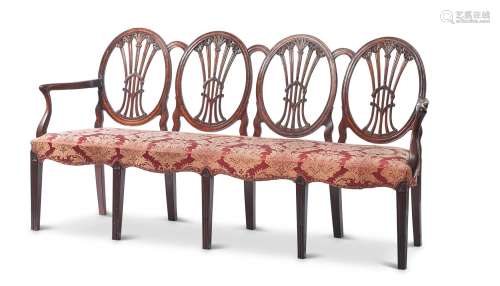 A GEORGE III CARVED PADOUK CHAIR-BACK SETTEE