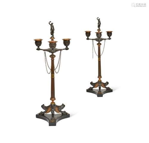 A PAIR OF BRONZE AND GILT THREE LIGHT CANDELABRA