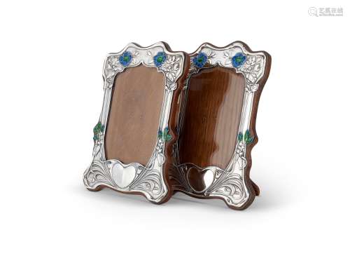 A PAIR OF ARTS AND CRAFTS SILVER PHOTOGRAPH FRAMES BY HENRY ...