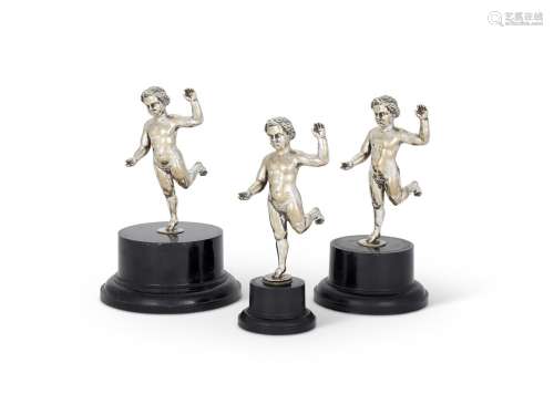 A SET OF THREE VICTORIAN ELECTRO-PLATED MODELS OF PUTTI RUNN...