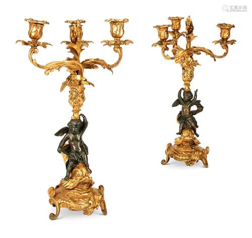 A PAIR OF FRENCH GILT AND PATINATED BRONZE CANDELABRA