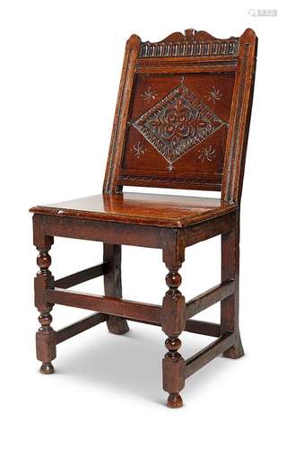 A Charles II oak backstool