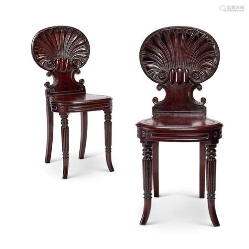 A pair of Regency mahogany carved shell back hall chairs att...