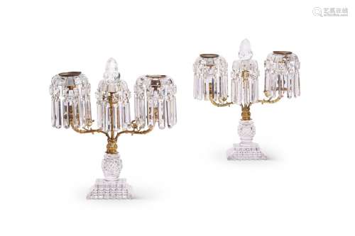 A pair of Regency cut glass lustre twin-light candelabra