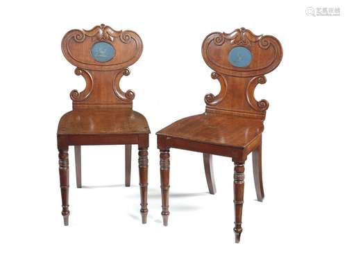 A pair of Regency mahogany hall chairs