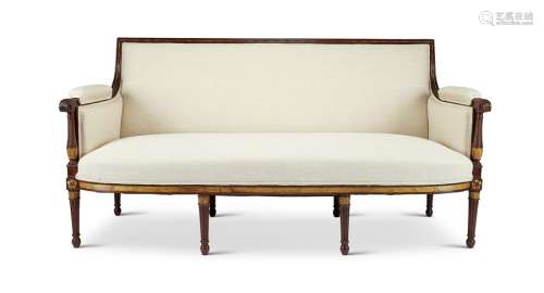 A Louis XVI style mahogany and parcel gilt sofa