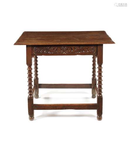 A Charles II carved oak side table