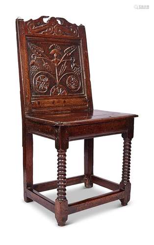 A Charles II oak backstool