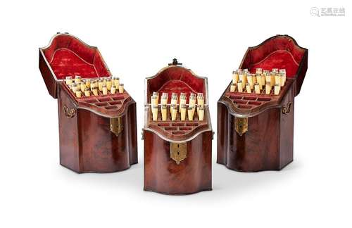 A set of three George III mahogany serpentine knife boxes