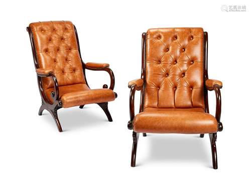 A matched pair of Regency mahogany library open armchairs