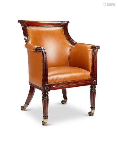 A Regency carved mahogany bergère library chair