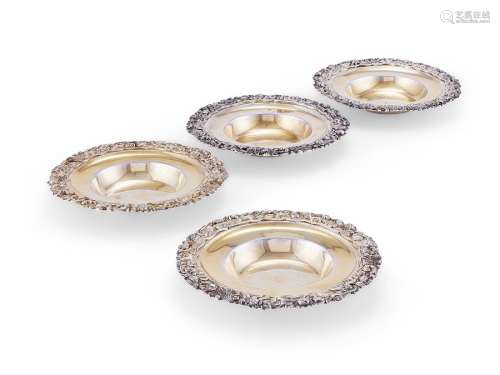 A pair of George IV parcel-gilt silver small dishes together...