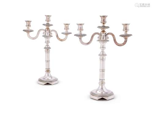 A pair of French silver three-light candelabra by with 1st s...