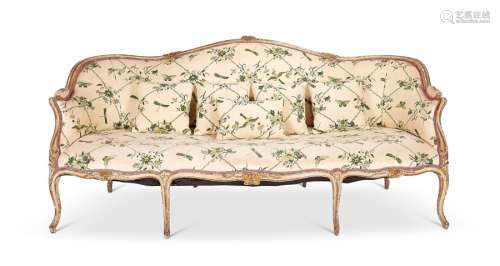 A George III cream and parcel gilt carved serpentine settee