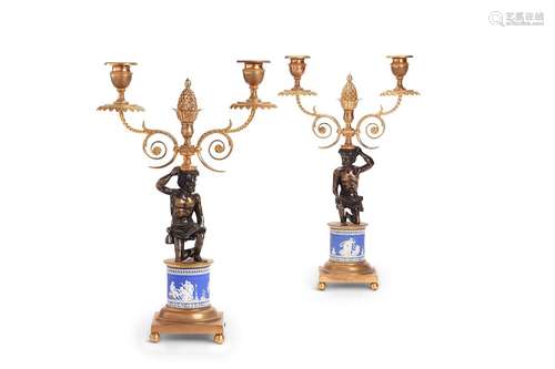 A pair of Regency gilt bronze jasper ware twin-light candela...