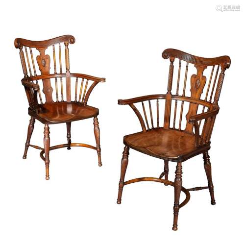 A pair of Victorian mahogany Windsor open armchairs attribut...