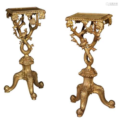 A pair of George III style carved gilt wood tables / torcher...