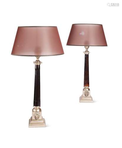 A pair of ebonised and plated brass column table lamps