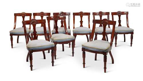 A set of nine late Victorian carved mahogany salon chairs