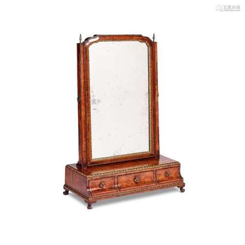 A George I walnut, crossbanded and parcel gilt toilet mirror