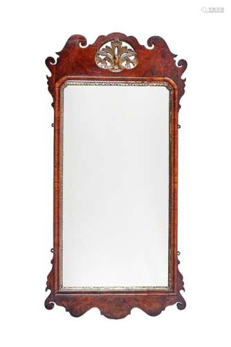 A George III mahogany and parcel gilt fret carved mirror
