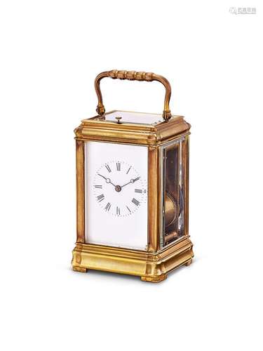 A brass repeating carriage clock with collapsible handle