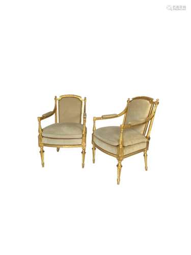 A pair of George III style carved giltwood armchairs in the ...
