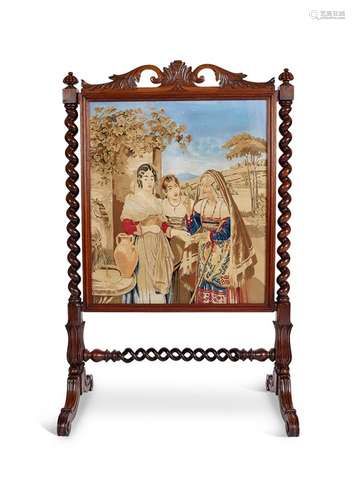 An early Victorian rosewood carved needlework fire screen