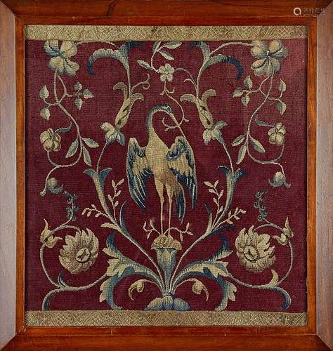 An 18th century needlework panel in a later frame