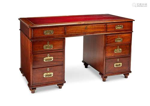 A late Victorian mahogany campaign pedestal desk