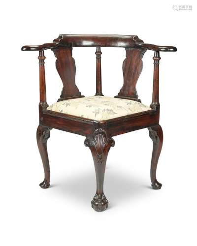 A George II carved mahogany corner chair