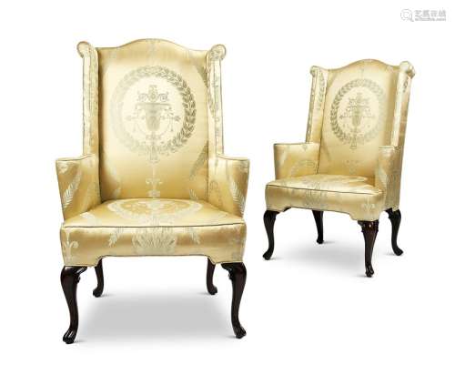 A pair of 20th century Queen Anne style mahogany wing armcha...