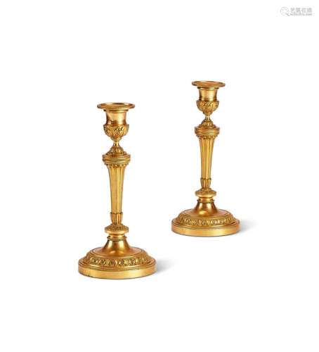 A pair of Louis XVI gilt bronze candlesticks
