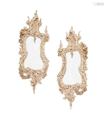 A pair of late 19th century rococo style carved mirrors