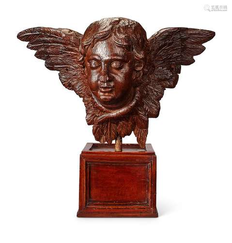 A carved head of a winged cherub, European, 18th / 19th cent...