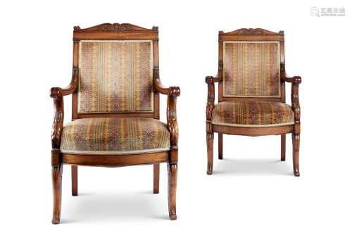 A pair of Empire mahogany caved fauteuils