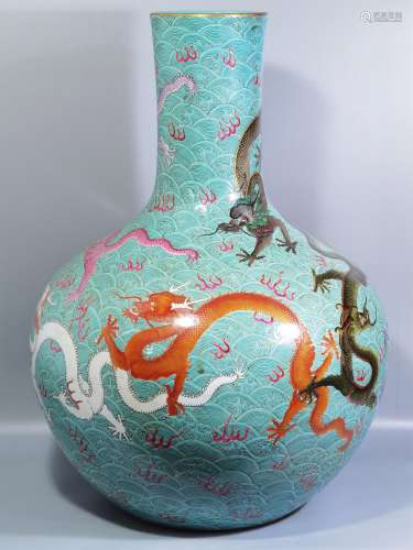 A QING DYNASTY QIANLONG FAMILLIE ROSE SEA COLOR NINE DRAGONS...