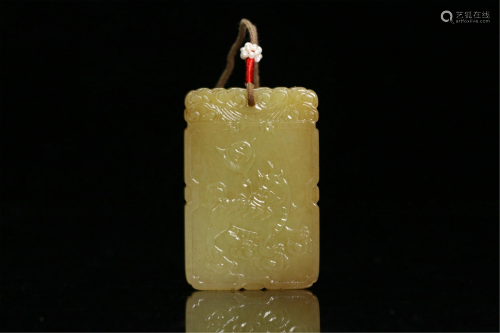 A CHINESE YELLOW JADE CARVED KYLIN PENDANT