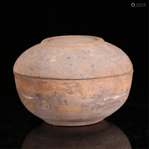 A CHINESE POTTERY JAR AND COVER