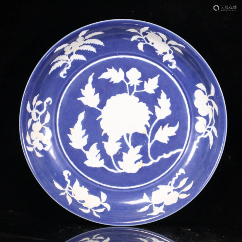 A CHINESE BLUE GLAZED PORCELAIN PLATE WITH WHITE