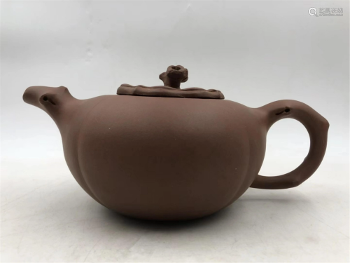 A CHINESE PERSIMMON SHAPED YIXING CLAY TEA POT
